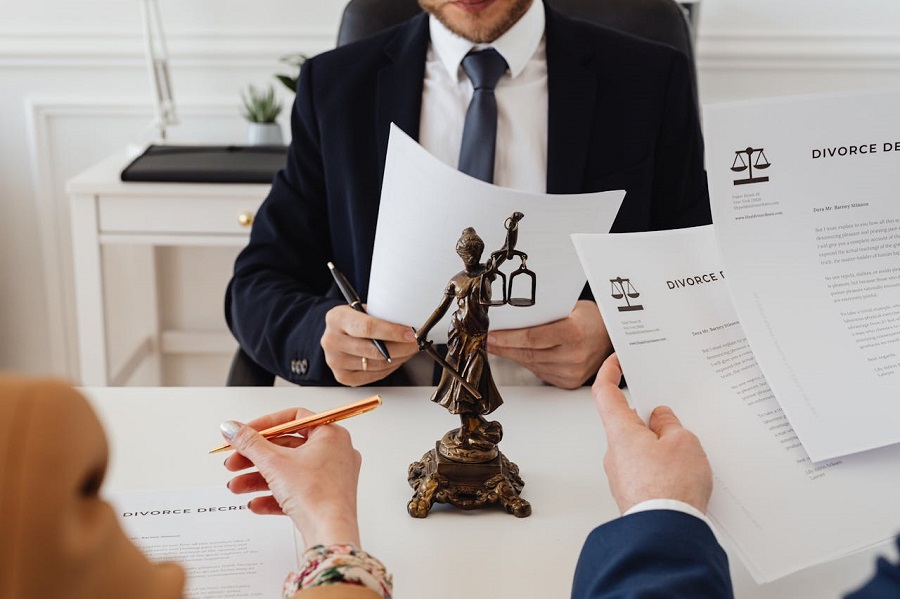 Two couples signing their amicable divorce agreements